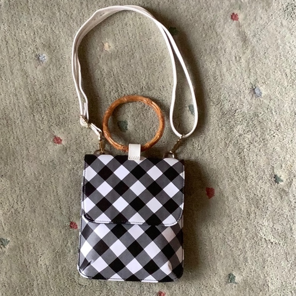 Carlos Santana black & white check wristlet